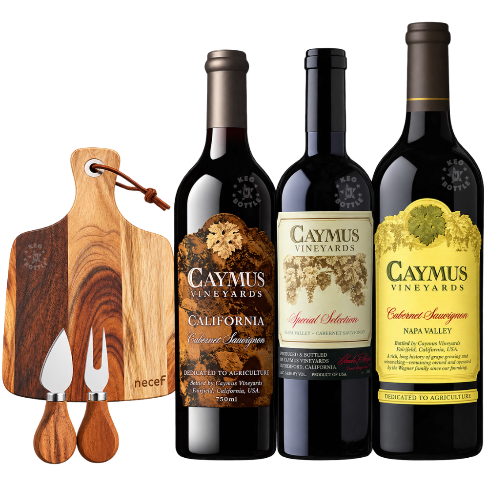 Caymus Cabernet Sauvignon wine and charcuterie gift set featuring three bottles of Caymus Vineyards Cabernet Sauvignon, including Napa Valley 1L, California 750mL, and Special Selection 750mL, alongside an acacia wood cheese board with matching knife and fork.