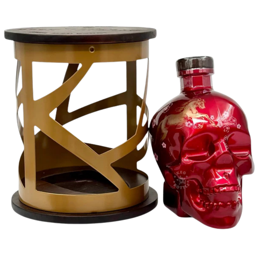 Crystal Head Year Of The Horse vodka gift set featuring red skull bottle inside decorative gold cage packaging