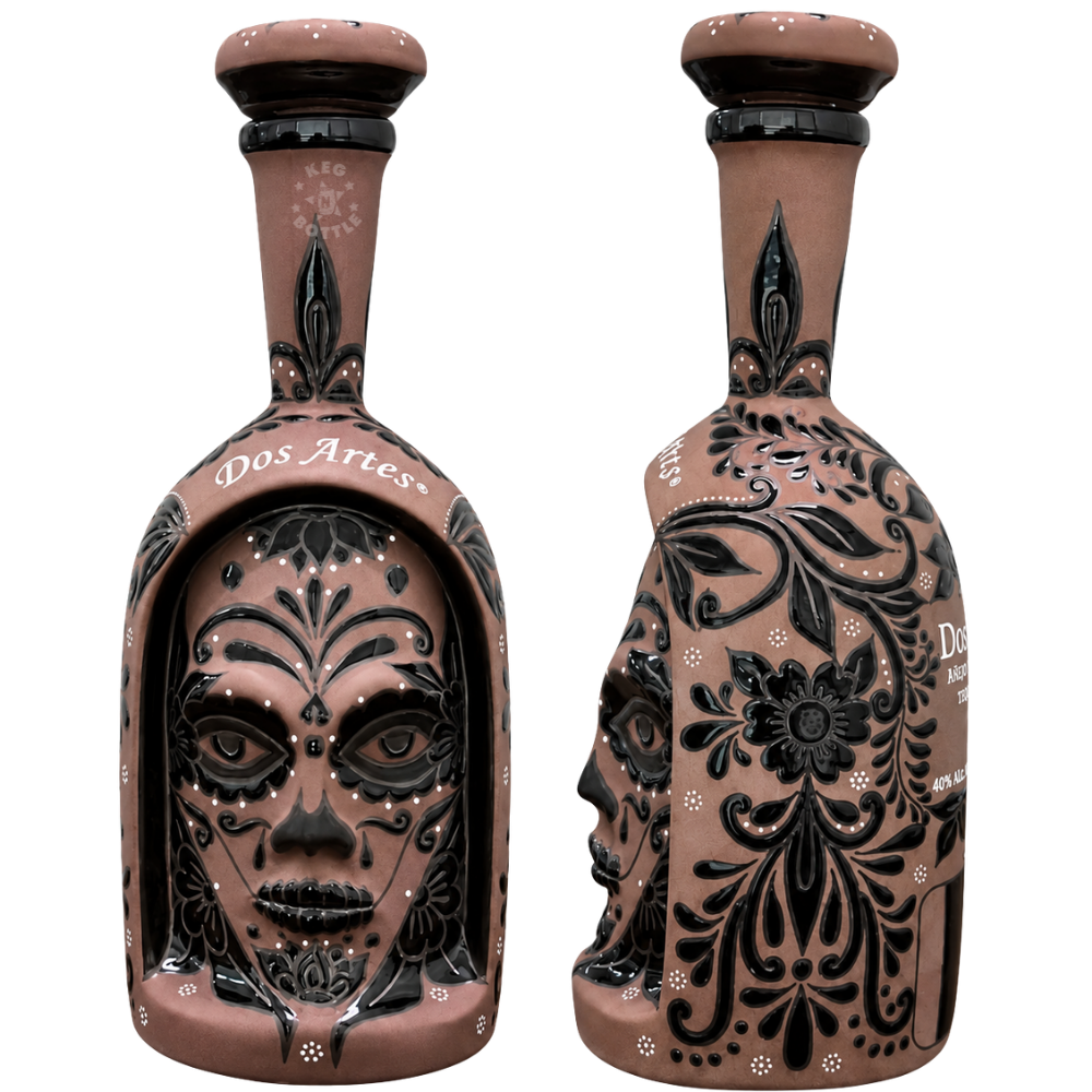 Dos Artes Calavera Doble Barrica Extra Añejo Tequila 1L in an intricately decorated ceramic Calavera bottle with sculpted face and black floral detailing.