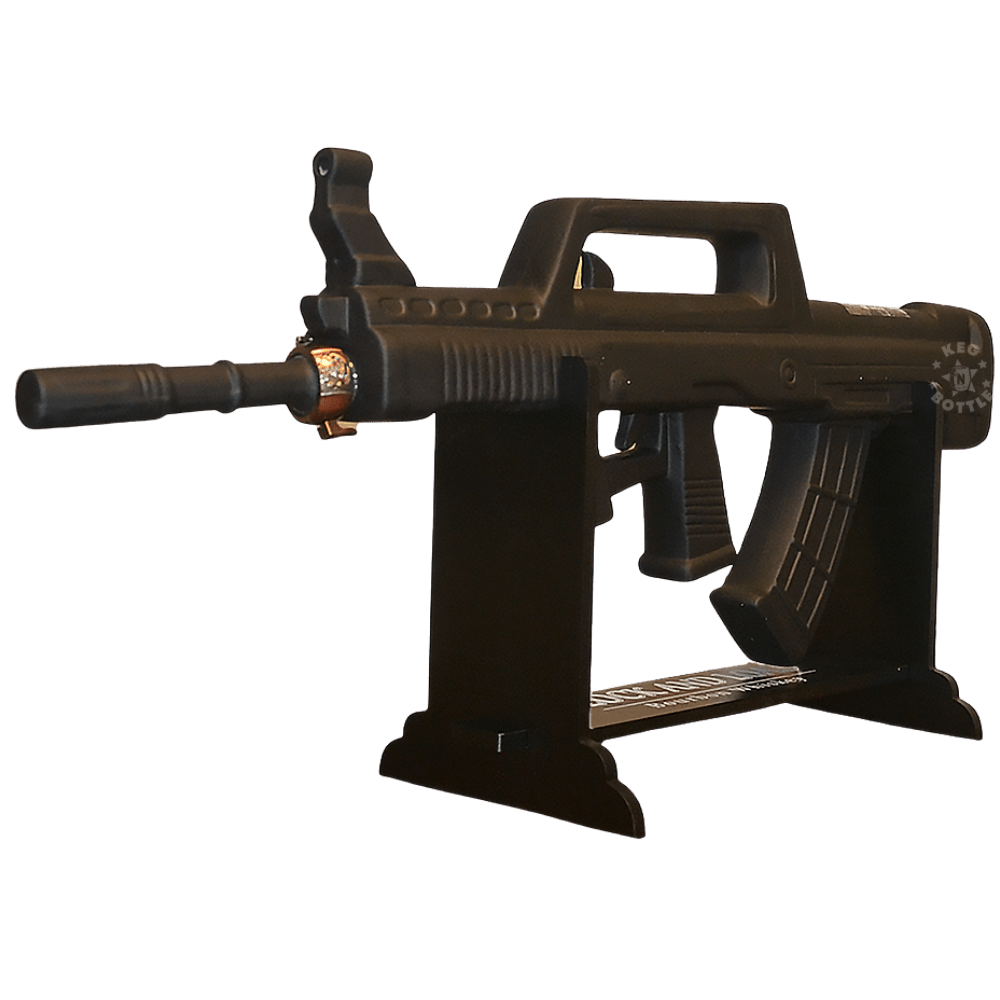 Lock & Load Bullpop Gun Collector's Edition Bourbon Whiskey 1.75L in a distinctive bullpup-style gun-shaped bottle with display stand and presentation box.