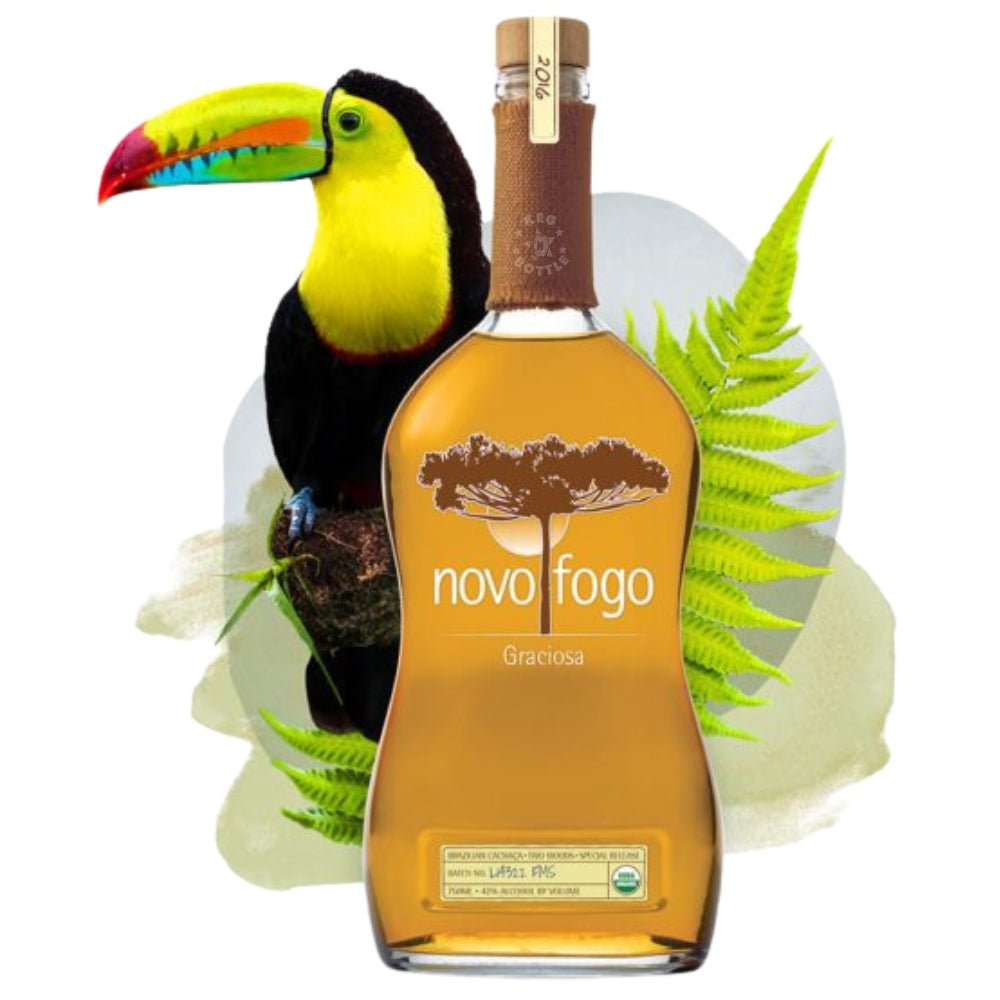 Bottle of Novo Fogo Graciosa Cachaça with rainforest foliage and toucan illustration