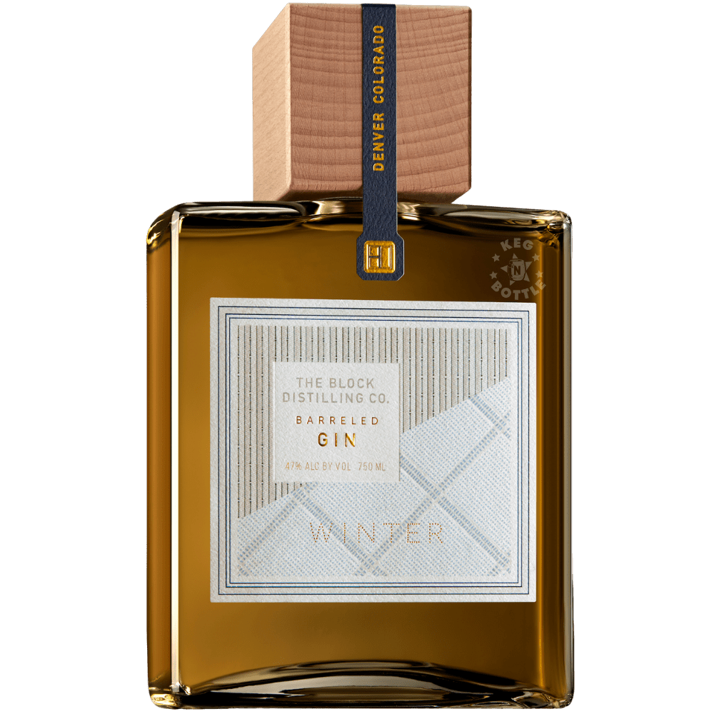 The Block Distilling Co. Winter Gin 750mL square glass bottle featuring amber-colored spirit, a white geometric Winter Gin label, and a natural wooden cap.