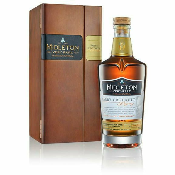 Bottle of Midleton Very Rare Barry Crockett Legacy Irish Whiskey with luxury wooden presentation box displayed beside bottle 2