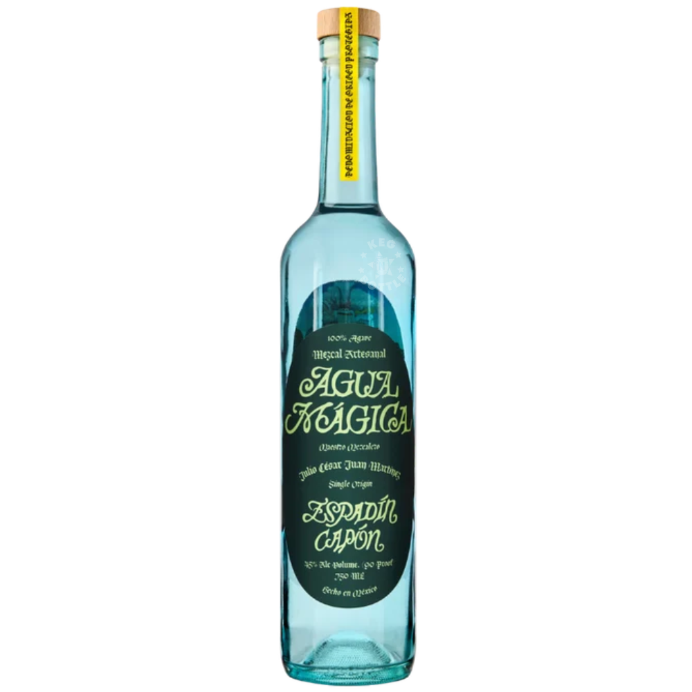 Agua Mágica Mezcal Espadín Capón 750mL turquoise glass bottle featuring a dark green decorative label, gold lettering, and natural cork stopper.
