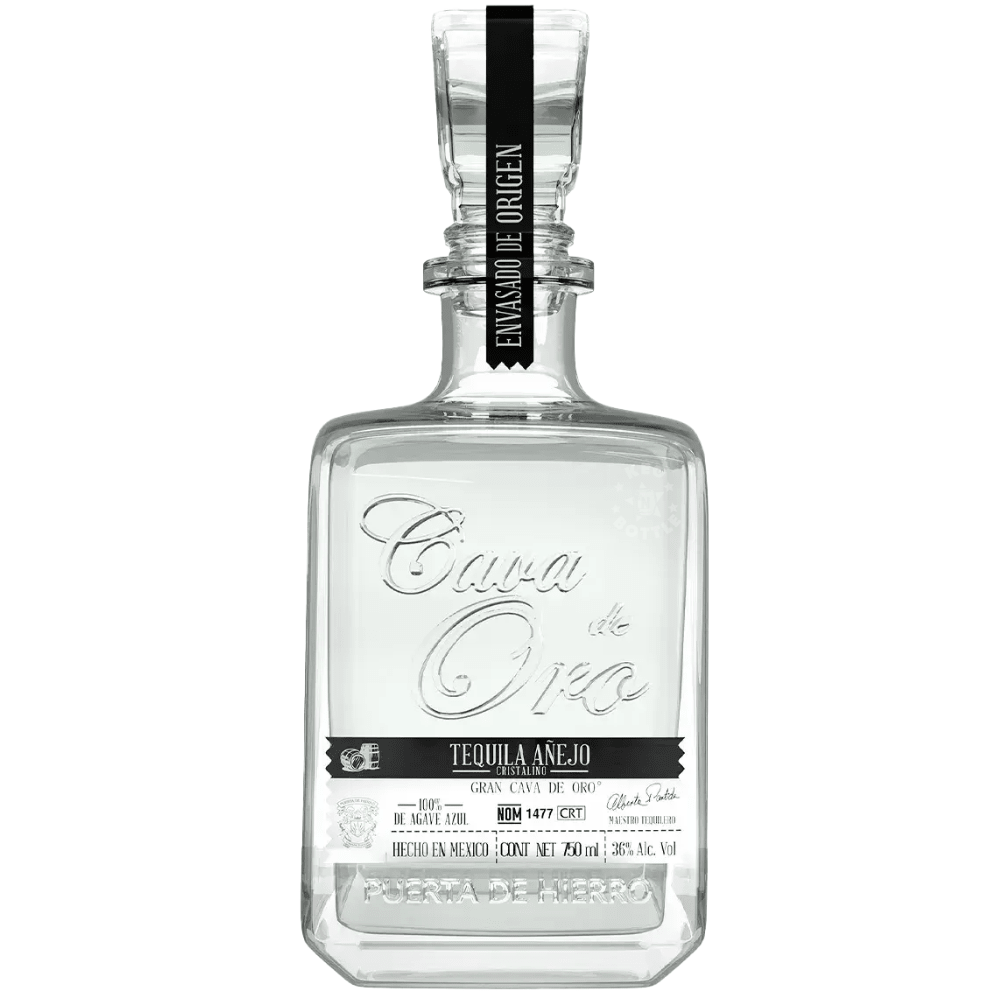 Cava de Oro Tequila Añejo Cristalino 750mL in a clear premium decanter-style bottle with black label and stopper.