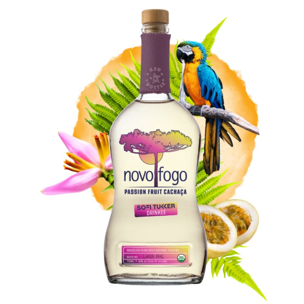 Bottle of Novo Fogo Passion Fruit Cachaça surrounded by tropical passion fruit and fern leaves
