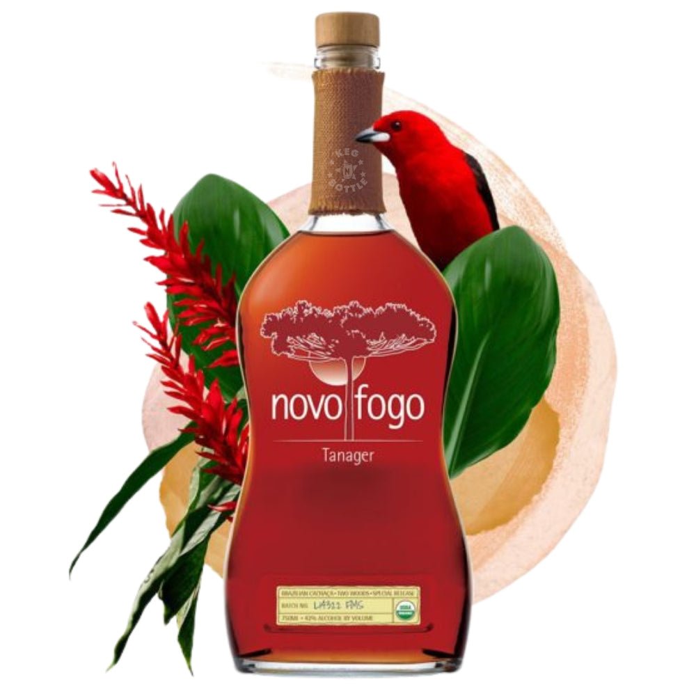 Bottle of Novo Fogo Tanager Cachaça with tropical flowers, rainforest leaves, and red bird illustration